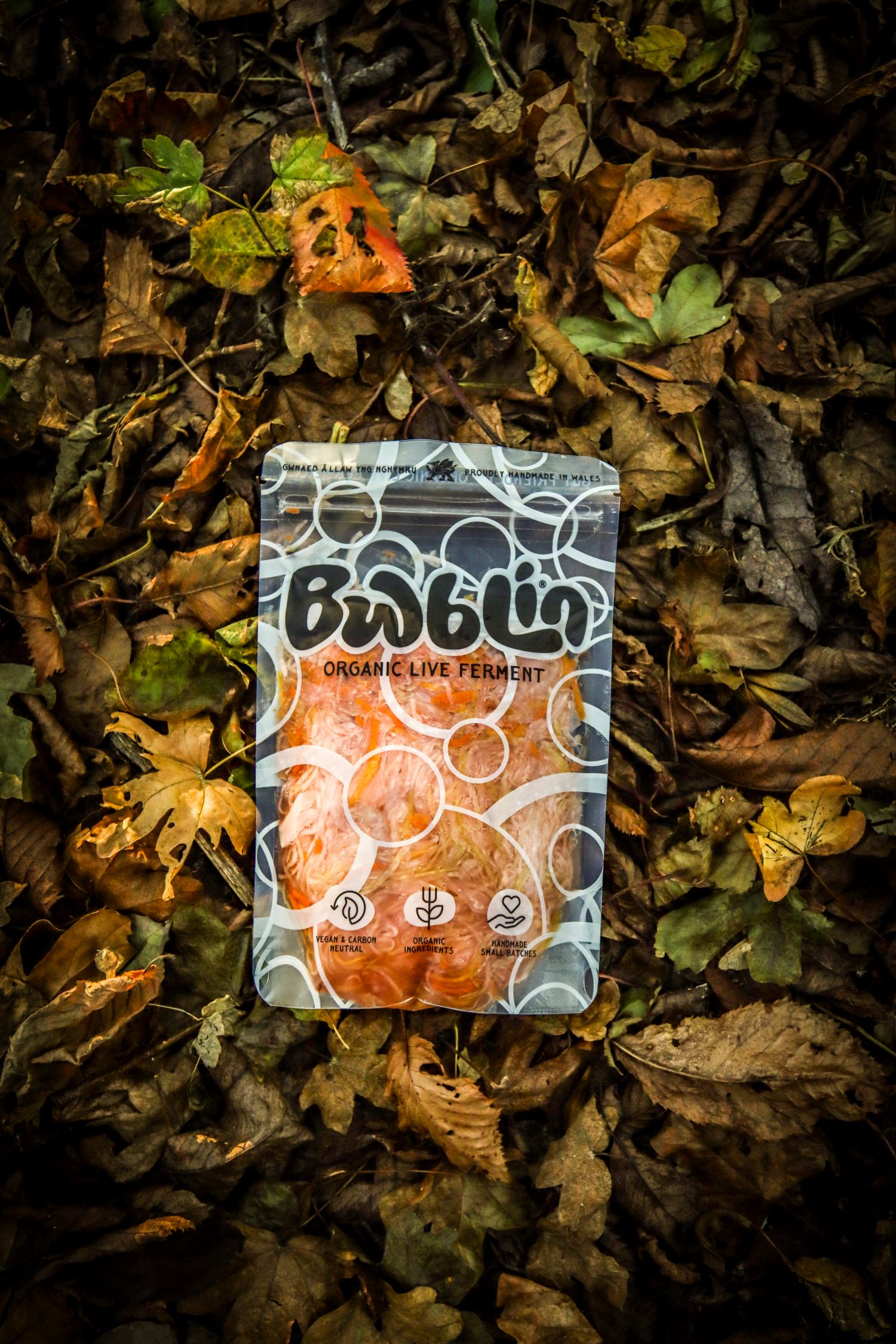 Packaged product labeled 'Bwblin' on a bed of leaves